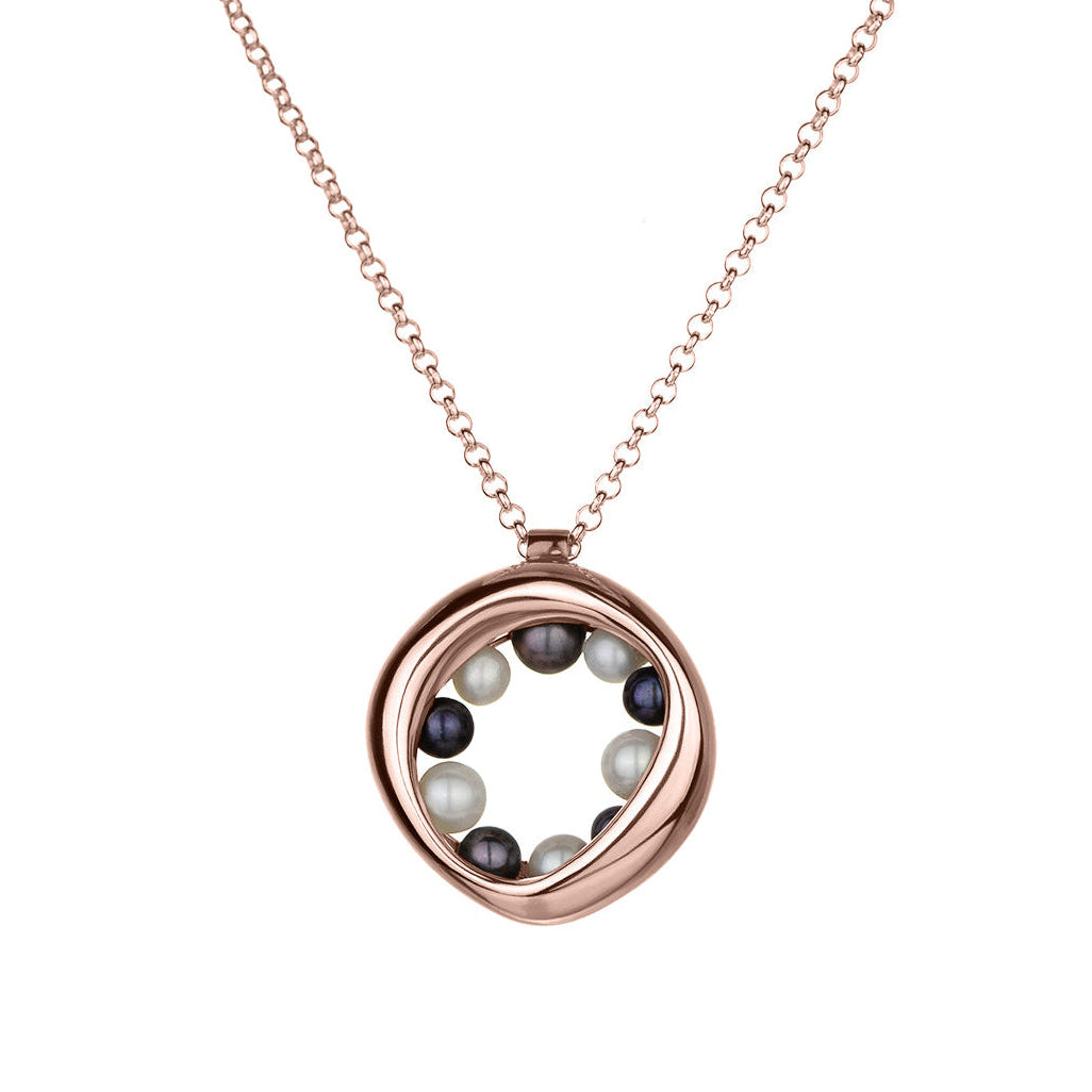 14KT rose gold necklace with a circular, organic pendant featuring black and white pearls