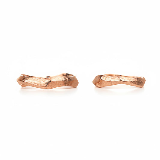 Pair of rose gold twig-shaped wedding rings