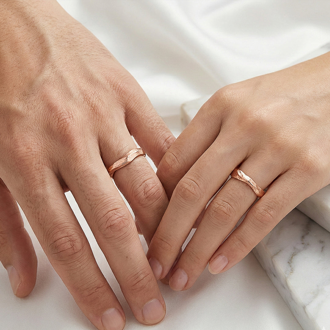 Pair of rose gold twig-shaped wedding rings