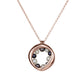 14KT rose gold necklace with a circular, organic pendant featuring black and white pearls