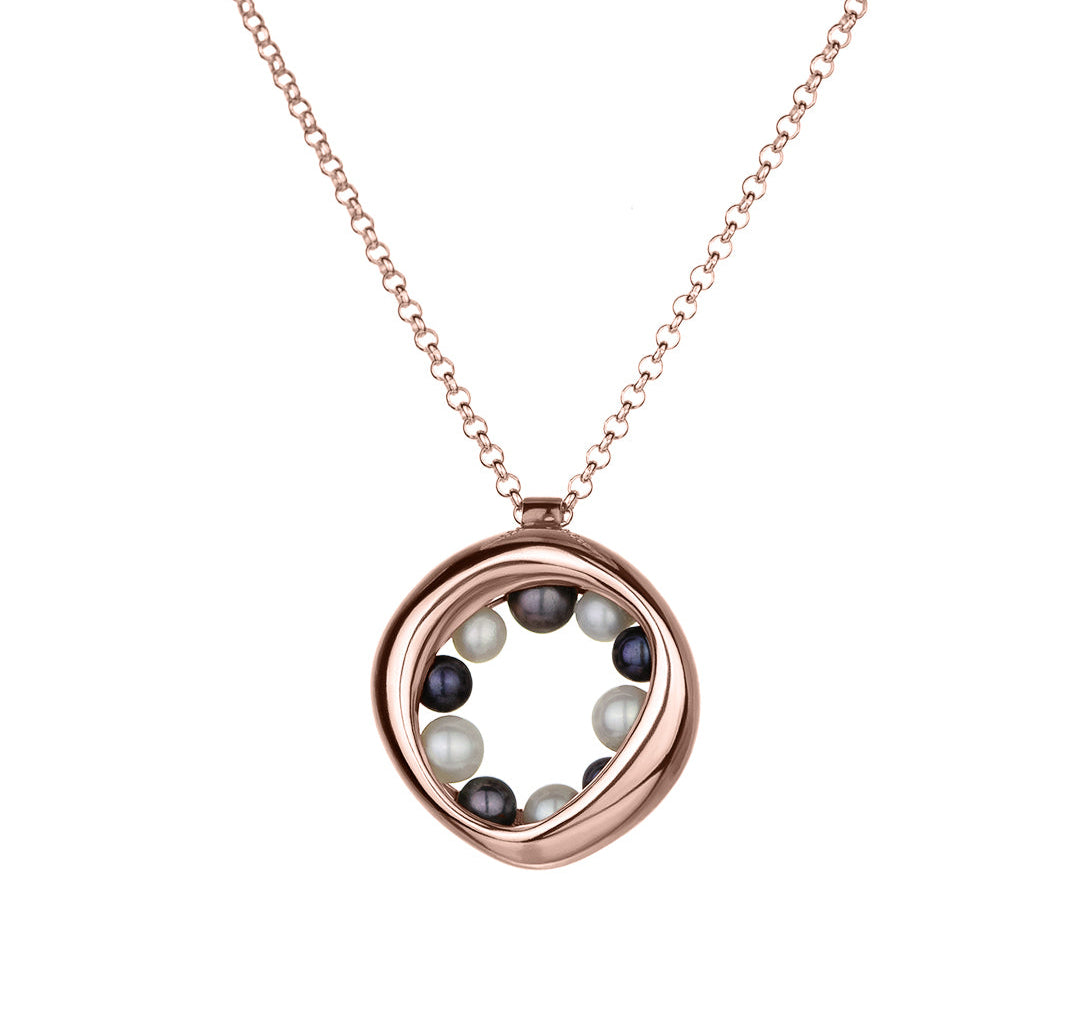 14KT rose gold necklace with a circular, organic pendant featuring black and white pearls